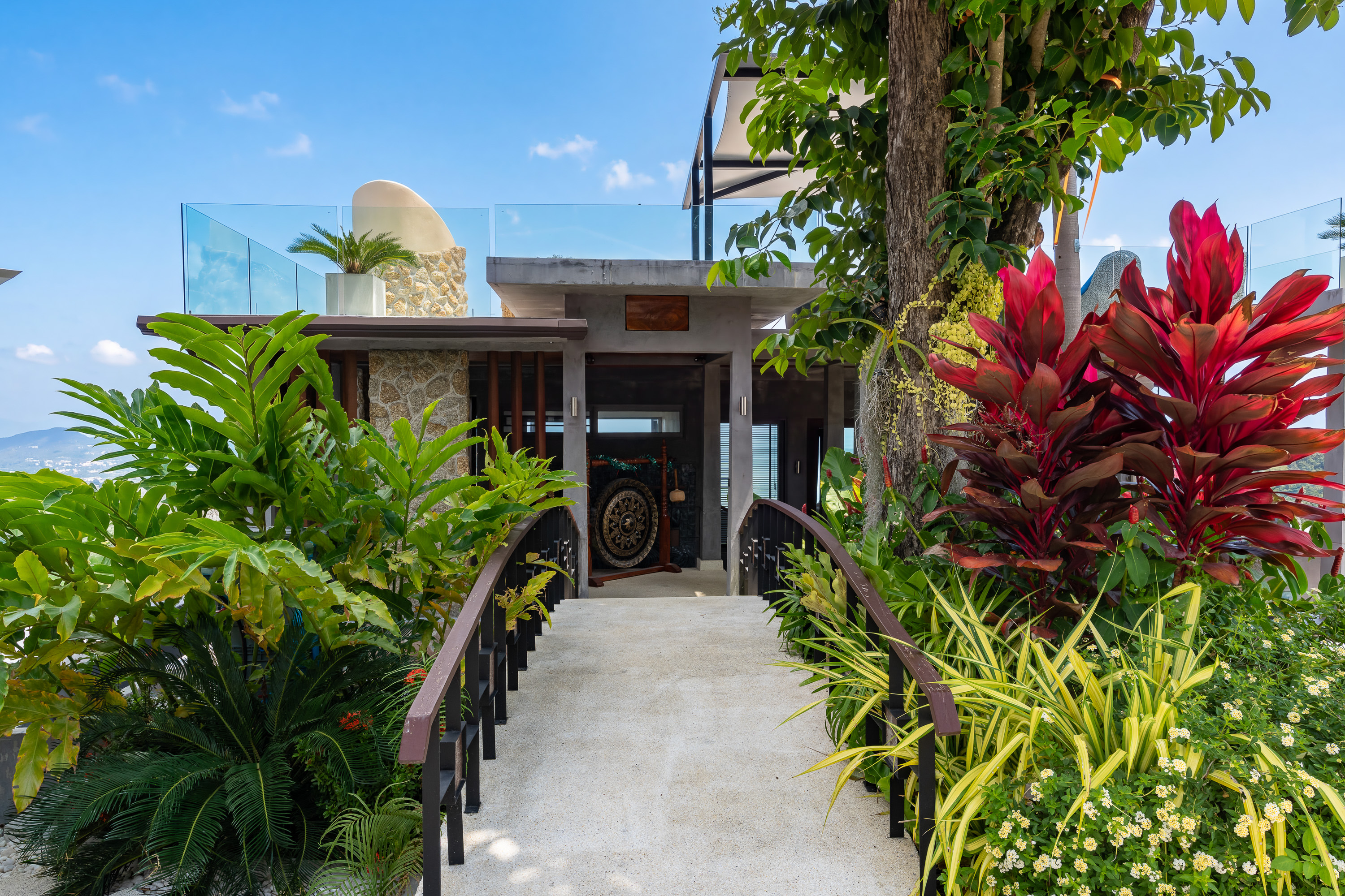 Garden walkway leading to the villa entrance